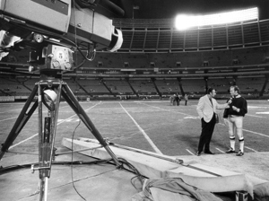 ABC broadcaster Howard Cowell interviews Green Bay Packers quarterback Bart Starr in 1971.